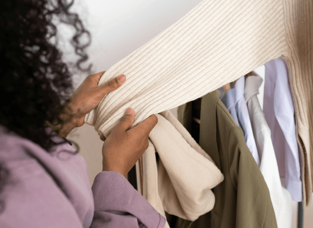 Person checking a sweater