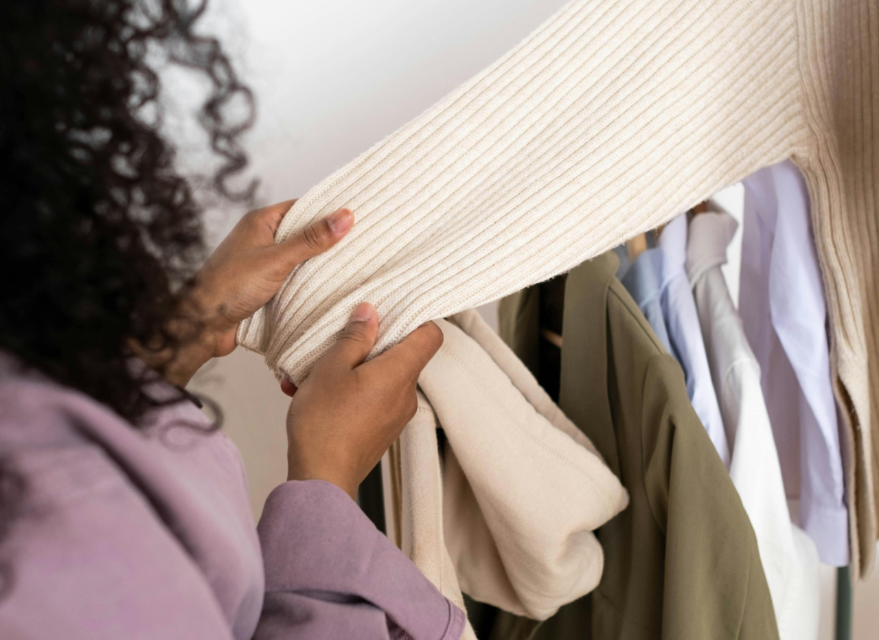 Person checking a sweater